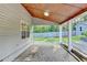 Covered patio with brick pavers providing a peaceful outdoor seating area at 4845 Dartford Dr, Powder Springs, GA 30127