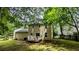 The back exterior of home features a well-maintained yard and a charming deck, perfect for outdoor relaxation at 4927 Millstone Walk, Stone Mountain, GA 30088