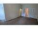 Bedroom with neutral walls, carpet floors, a closet, and a connecting bathroom, offering privacy and convenience at 4927 Millstone Walk, Stone Mountain, GA 30088