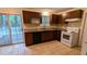 Well-equipped kitchen features tile floors, granite countertops, and a sliding door to the outside at 4927 Millstone Walk, Stone Mountain, GA 30088