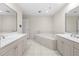 Bathroom featuring double sinks and a large soaking tub at 50 Biscayne Nw Dr # 2113, Atlanta, GA 30309