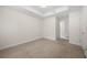 Spacious bedroom features neutral carpet and walls plus white trim and natural lighting at 50 Biscayne Nw Dr # 2113, Atlanta, GA 30309