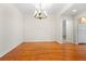 Open dining room area with hardwood floors and chandelier near the kitchen at 50 Biscayne Nw Dr # 2113, Atlanta, GA 30309