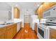 Well-lit kitchen features sleek appliances and a practical layout next to the dining area at 50 Biscayne Nw Dr # 2113, Atlanta, GA 30309