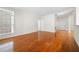 Hardwood floored living room with white walls offers plenty of natural light and easy access to entry at 50 Biscayne Nw Dr # 2113, Atlanta, GA 30309