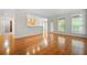 Bright living room featuring hardwood floors, plenty of light, and views to the outside balcony at 50 Biscayne Nw Dr # 2113, Atlanta, GA 30309
