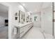 Bright bathroom featuring a glass shower, double vanity with drawers, and view to the outdoors through a window at 508 Hastings Dr, Peachtree City, GA 30269