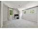 Upstairs bedroom with neutral carpet and large windows featuring backyard view at 508 Hastings Dr, Peachtree City, GA 30269