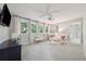 Bright and airy bedroom features three large windows, soft carpet, and ceiling fan at 508 Hastings Dr, Peachtree City, GA 30269