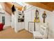 Angled view of a bonus room with guitars on the wall, a sitting chair, and a view to a balcony at 508 Hastings Dr, Peachtree City, GA 30269
