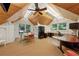 Bright bonus room featuring custom wood ceilings, a ceiling fan, and ample space for both a dining table and workspace at 508 Hastings Dr, Peachtree City, GA 30269