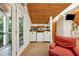 A bonus room featuring a balcony, kitchenette, mounted tv, and a comfortable sitting chair at 508 Hastings Dr, Peachtree City, GA 30269