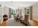 Formal dining room with elegant chandelier, hardwood floors, and views of the yard at 508 Hastings Dr, Peachtree City, GA 30269