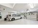 The spacious garage has pristine white walls and space for cars and storage at 508 Hastings Dr, Peachtree City, GA 30269