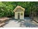 Charming building with a birdcage and meticulous landscaping, nestled in a tranquil wooded area at 508 Hastings Dr, Peachtree City, GA 30269