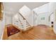 Spacious foyer featuring hardwood floors, a staircase, and abundant natural light for a welcoming entrance at 508 Hastings Dr, Peachtree City, GA 30269