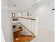 Hallway features a wooden staircase and a view of the living room below at 508 Hastings Dr, Peachtree City, GA 30269