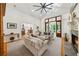 Bright living room features a cozy fireplace, built-in shelving, and comfortable seating arrangement at 508 Hastings Dr, Peachtree City, GA 30269