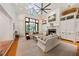 Bright living room features a cozy fireplace, built-in shelving, and comfortable seating arrangement at 508 Hastings Dr, Peachtree City, GA 30269