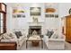 Bright living room features a cozy fireplace, built-in shelving, and comfortable seating arrangement at 508 Hastings Dr, Peachtree City, GA 30269