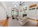 Bright living room with high ceilings, fireplace, and built-in cabinets offers a comfortable gathering space at 508 Hastings Dr, Peachtree City, GA 30269