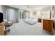 Large main bedroom with ample natural light, plush carpet, and access to a private balcony at 508 Hastings Dr, Peachtree City, GA 30269