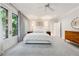 Bright main bedroom features plush carpet, French doors, and elegant furnishings for a relaxing retreat at 508 Hastings Dr, Peachtree City, GA 30269