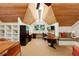 Well-lit home office with custom built-ins, ample desk space, and a cozy seating area at 508 Hastings Dr, Peachtree City, GA 30269