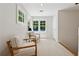 Sitting area featuring natural light from multiple windows and two armchairs at 508 Hastings Dr, Peachtree City, GA 30269