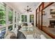 Bright sunroom features a ceiling fan, multiple windows, and natural light at 508 Hastings Dr, Peachtree City, GA 30269