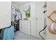 Well organized walk-in closet with drawers, shelves, cupboards, carpet, and a window at 508 Hastings Dr, Peachtree City, GA 30269