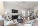 Comfortable living room featuring modern decor, neutral color palette, and hardwood floors at 627 Skytop Dr, Cumming, GA 30040