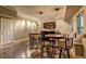 Finished basement features a bar with custom lighting, seating, and hardwood flooring at 1239 Side Step Trace, Lawrenceville, GA 30045