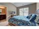 Bedroom featuring a large bed and an ensuite bathroom at 1239 Side Step Trace, Lawrenceville, GA 30045