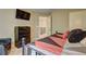 Comfortable bedroom featuring cozy bed and a view into hallway at 1239 Side Step Trace, Lawrenceville, GA 30045