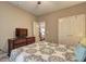 Comfortable bedroom featuring a double door closet and staircase in the background at 1239 Side Step Trace, Lawrenceville, GA 30045