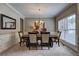 Formal dining room with elegant decor and a large window with plenty of light at 1239 Side Step Trace, Lawrenceville, GA 30045