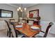 Elegant dining room with wood table, setting, and nice decor at 1239 Side Step Trace, Lawrenceville, GA 30045