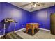 Basement room features bright blue walls, and hosts a treadmill and a foosball table at 1239 Side Step Trace, Lawrenceville, GA 30045