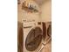 Modern laundry room with a pair of front load washer and dryer at 1239 Side Step Trace, Lawrenceville, GA 30045
