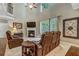 Bright living room featuring tall ceilings, fireplace, and a large window view at 1239 Side Step Trace, Lawrenceville, GA 30045
