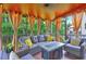 Cozy screened-in porch with stylish seating area and overhead fan and lighting at 1239 Side Step Trace, Lawrenceville, GA 30045