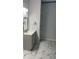 Modern bathroom with stylish vanity, and tile floors for a sleek and updated look at 1349 Orchard Park Dr, Stone Mountain, GA 30083