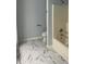 Simple bathroom featuring a tub, a toilet and new tile floors for a clean and modern look at 1349 Orchard Park Dr, Stone Mountain, GA 30083