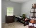 This bedroom can double as an office with lots of light, carpet, and neutral walls, perfect for many design options at 1349 Orchard Park Dr, Stone Mountain, GA 30083