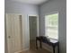Neutral bedroom featuring carpet floors, a walk in closet, and a window for great natural light at 1349 Orchard Park Dr, Stone Mountain, GA 30083