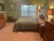 Cozy bedroom with carpet floors, a large window, and neutral wall color that makes it a relaxing space at 1349 Orchard Park Dr, Stone Mountain, GA 30083