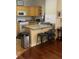 Traditional kitchen featuring tile floors, granite countertops, wood cabinets, and stainless steel appliances at 1349 Orchard Park Dr, Stone Mountain, GA 30083