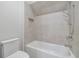 Bathroom featuring a shower/tub combination with tiled walls and a niche for toiletries at 158 Palisade Dr, Rydal, GA 30171