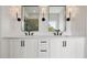 Bathroom with double vanity, white cabinets, modern fixtures, and stylish lighting above the dual sinks at 158 Palisade Dr, Rydal, GA 30171